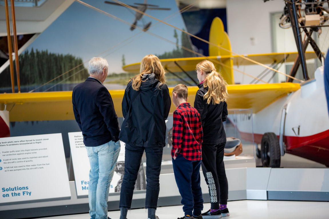 a family learns about flying boats at an aviation museum