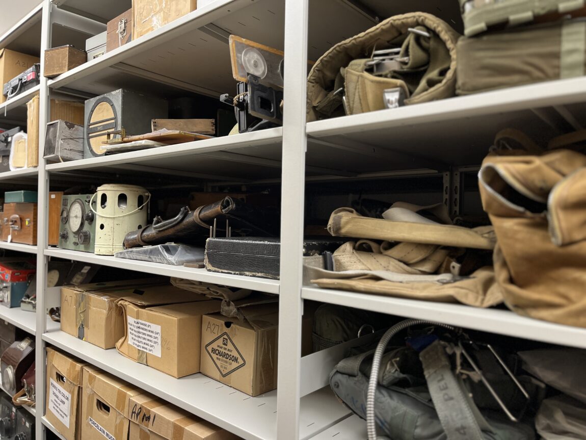 Assorted aviation artefacts sit on metal shelving in the Royal Aviation Museum's state-of-the-art collections and archives storage room. 