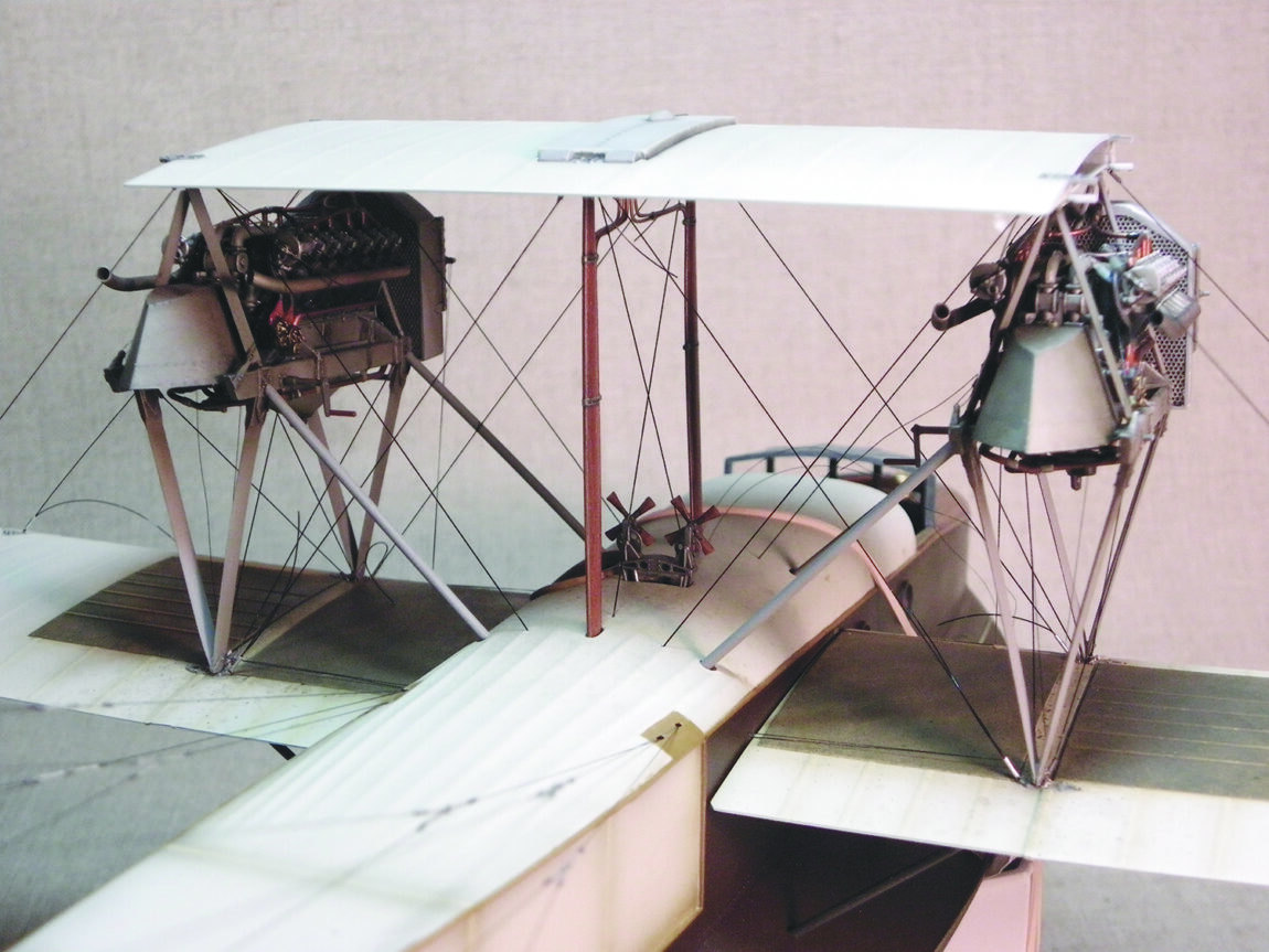 Partial view of a model of a Curtiss H-16 flying boat. Forward part of fuselage is visible along with portions of wings.