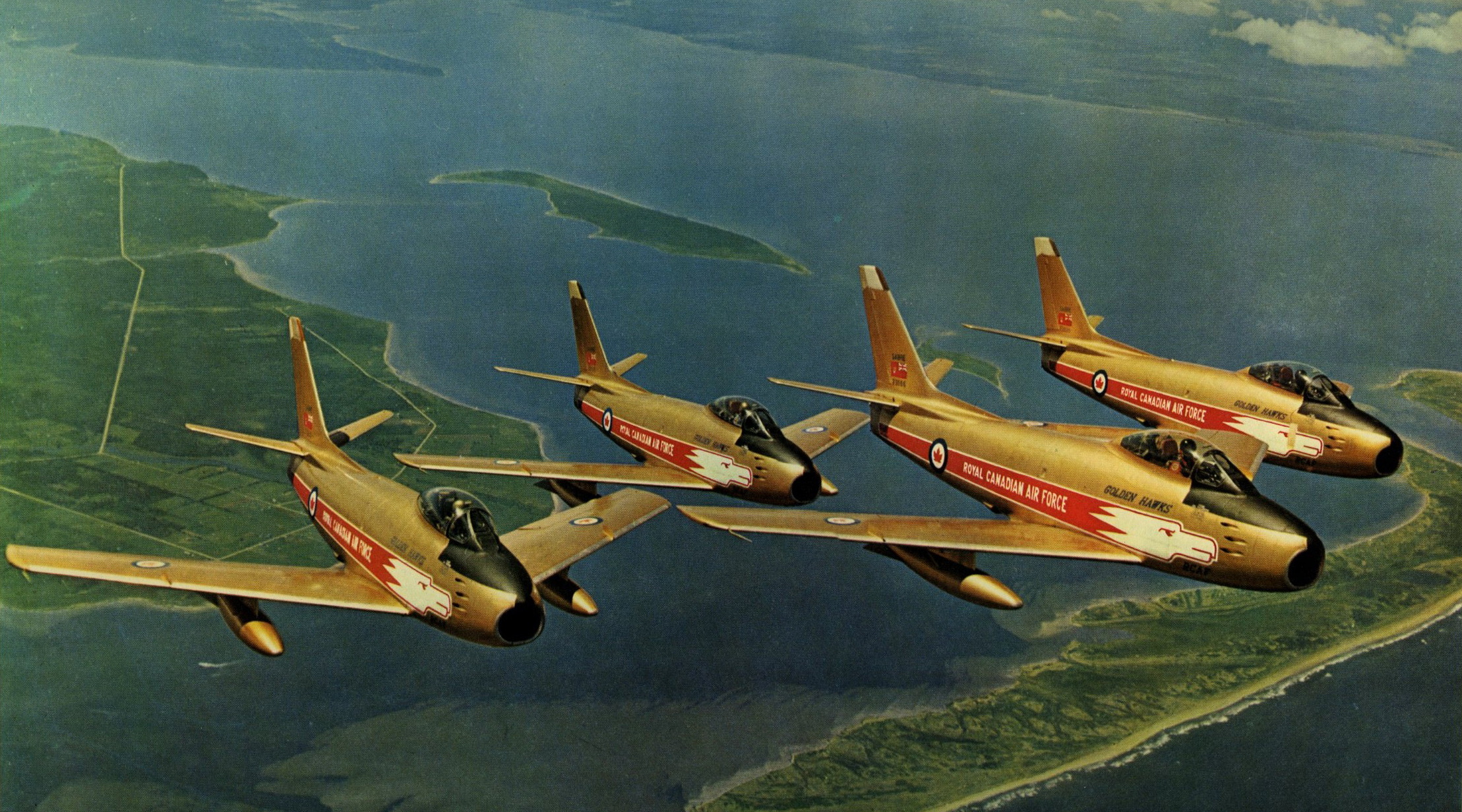 Four Canadair Sabres in Golden Hawks livery fly in formation