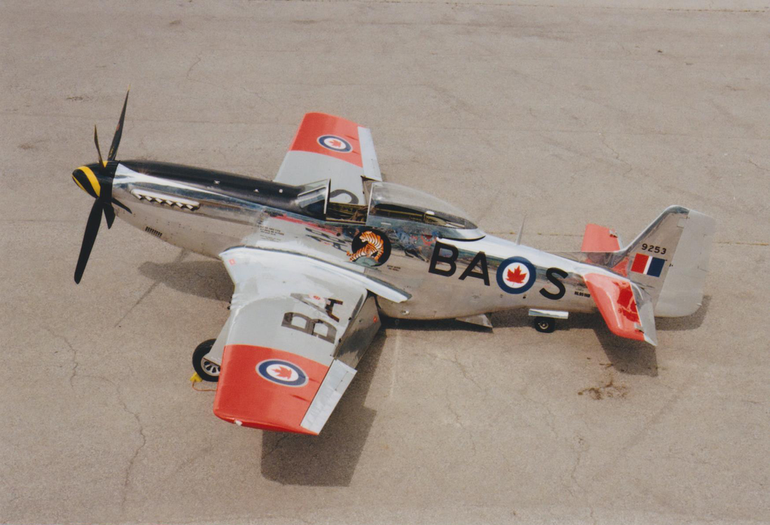 A P-51D Mustang aircraft parked on an airfield