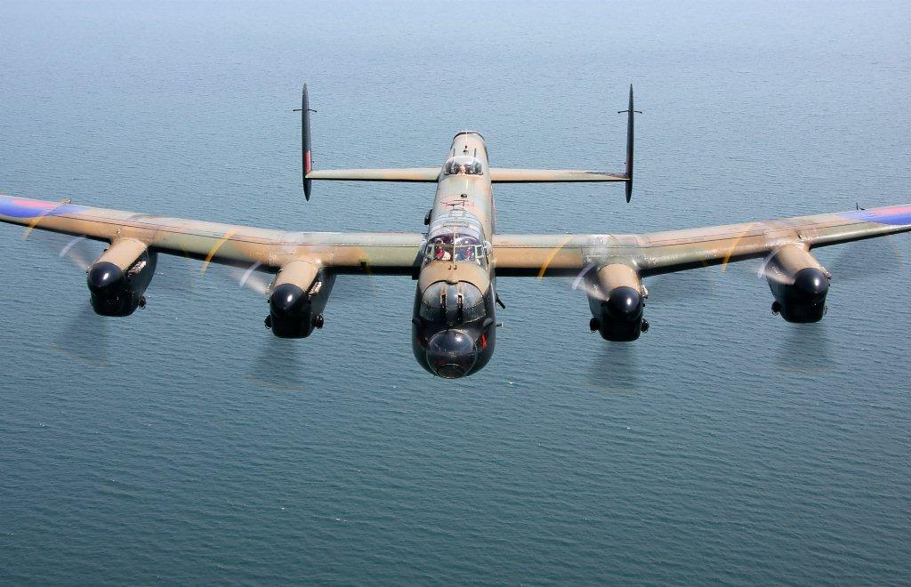 Avro Lancaster in flight over water